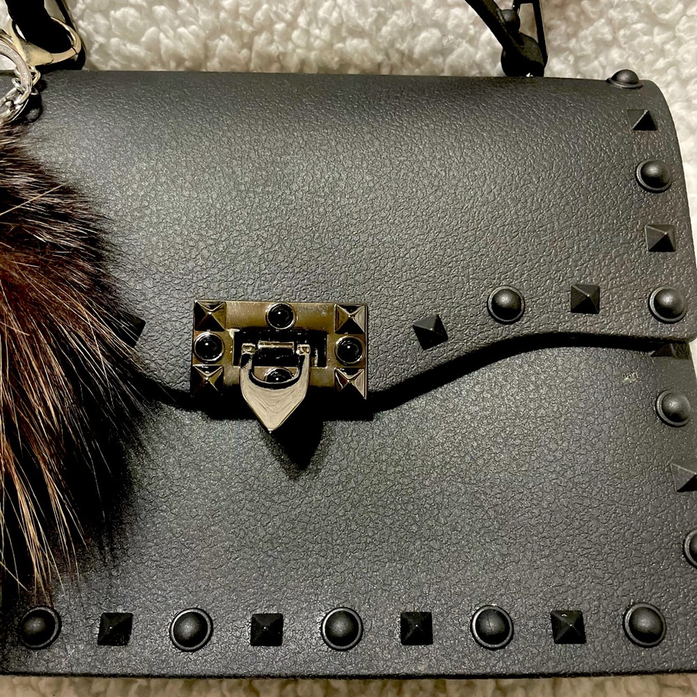A Black lovely, small and everyday Purse.